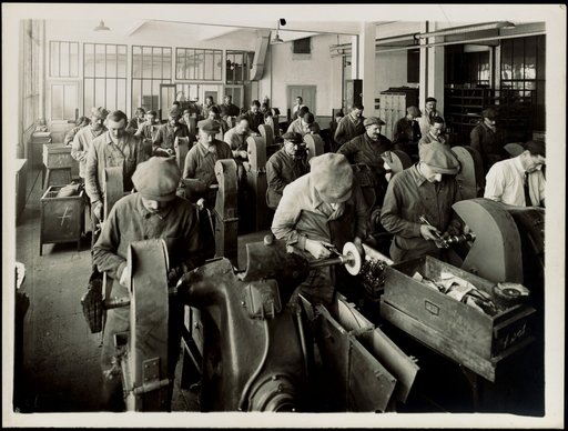 Factory hall with workers at polishing machines, commissioned by "Ericsson"