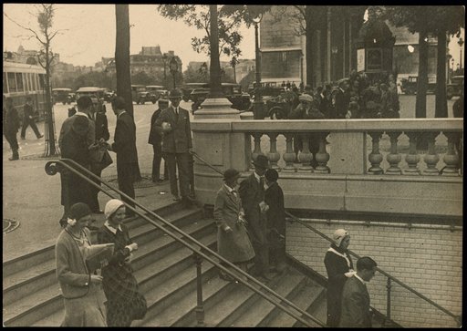 Pedestrians on the stairs to the Métro