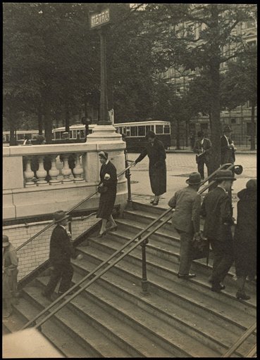 Pedestrians on the stairs to the Métro