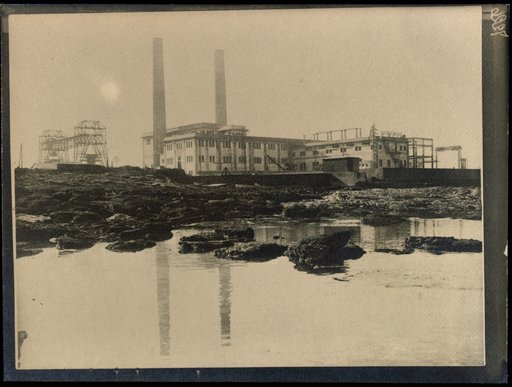 Industrial landscape with factory buildings and two chimneys
