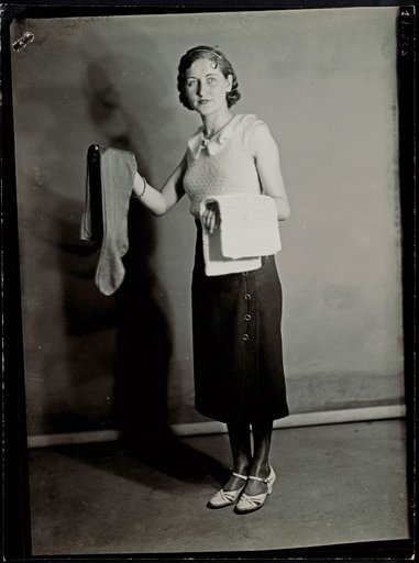 Standing Young Woman with Stockings and a Towel