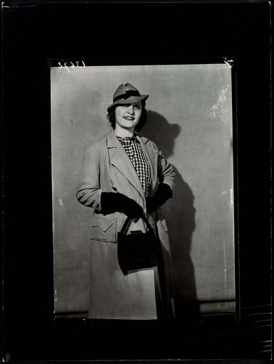 Woman with Handbag and Matching Gloves