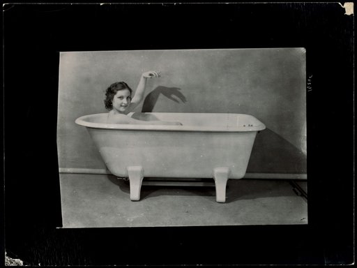 Woman in a bathtub, advertisement for "Crystal"