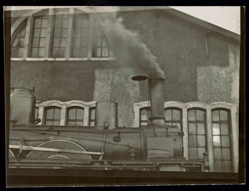 Steam locomotive in front of a building, advertisement for "Compagnie de chemins de fer de Paris à Orléans"