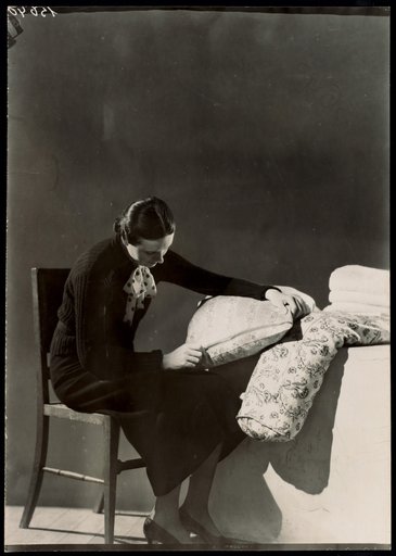 Seated Woman with Zipper Cushion, Photograph for "Fermeture Eclair" Calendar