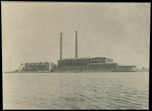 Manufacturing building with chimneys by the water