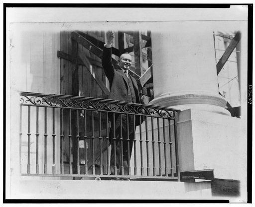 President Coolidge waving a greeting to the throngs of children gathered in the White House grounds to roll Easter eggs
