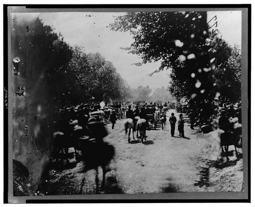 Soldiers(?) in wagons and mounted on horses during the "grand review" of the Union Army, Washington, D.C.