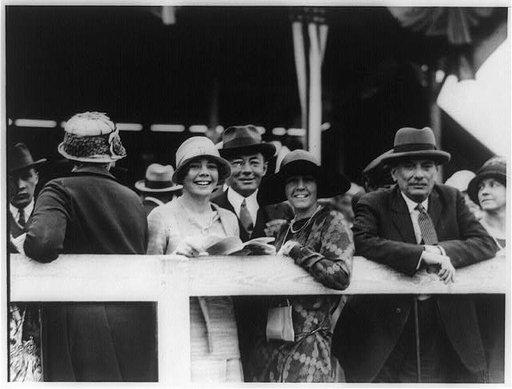 Theodore Douglas Robinson, the Assistant Secretary of the Navy, with Mrs. Robinson and their daughter, Helen, snapped at the National Capital Horse Show today