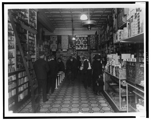 Interior of back of People's Drug Store, 14th and U(?) Streets, Washington, D.C., with employees and customers, some seated at soda fountain
