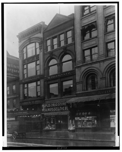 Exterior of People's Drug Store, 11th and G Streets, Washington, D.C., with other shops