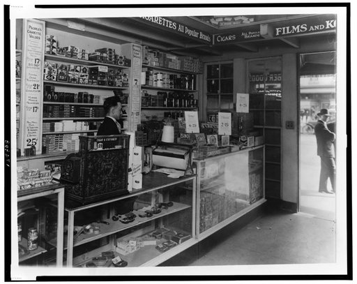 Interior of People's Drug Store, No. 5, 8th and H Streets, N.E., Washington, D.C., with employee behind counter