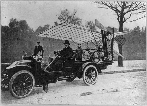 Alberto Santos-Dumont taking his Demoisille monoplane out to the practice grounds for a flight, 1909