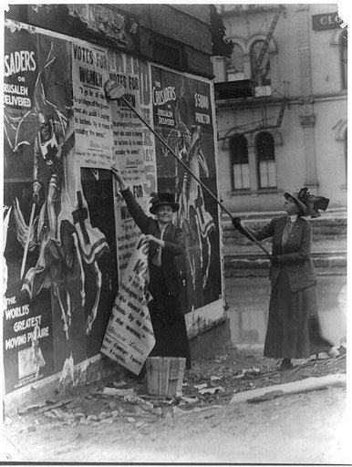 Miss Louise Hall with brush and Miss [i.e. Mrs.] Susan Fitzgerald assisting bill posting in Cincinnati