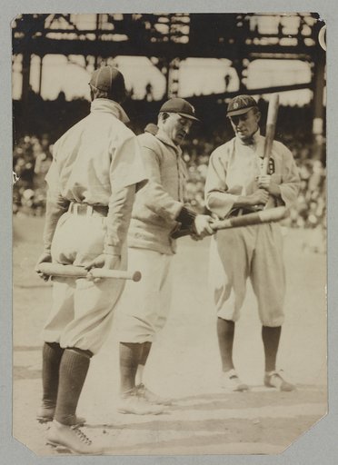 Honus Wagner of the Pittsburgh Pirates and Ty Cobb of the Detroit Tigers test bats, probably at the 1909 World Series