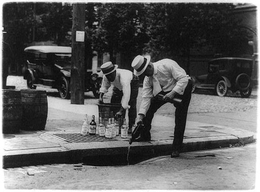 Pouring whiskey into a sewer