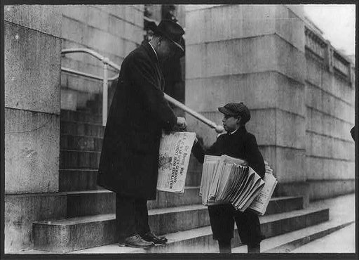 Man buying The Evening Star from newsboy, Washington, D.C. - headline reads "U.S. at War with Germany"