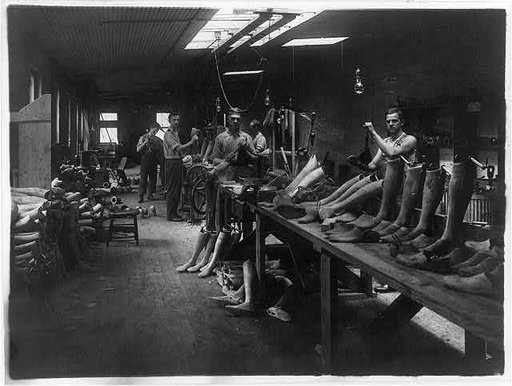 Men at work [making artificial legs] in the J.E. Hangar shop, a manufacturer of artificial limbs in Washington, D.C.