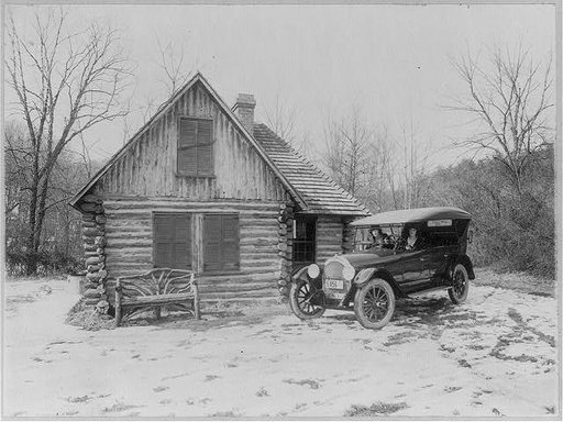 Two women in new Oldsmobile in front of the Joaquin Miller Cabin, Rock Creek Park, Washington, D.C.; picture made for Oldsmobile Sales Co.