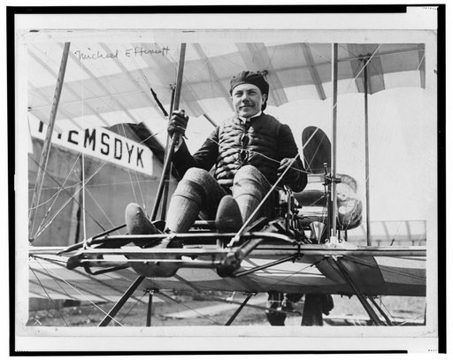 Mikhail Effimov, Russian aviator, full-length portrait, seated on airplane, facing front