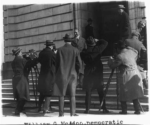 William G. McAdoo poses for news photos before entering Senate Office Building
