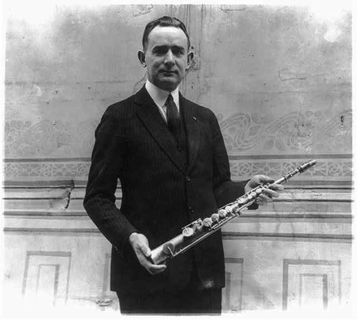 Tomm Brown, who claims to have had the first saxaphone act, posed with 1st saxaphone made by Adolph Sax, the inventor