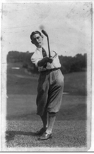 Tom Amour following through on golf swing