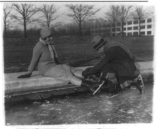 Ricardo and Angelica Pueyrredon putting on ice skates at Reflecting Pool