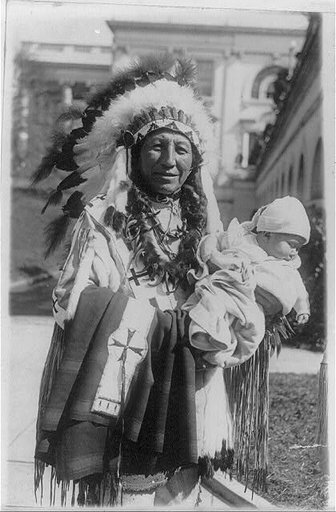 Chief Spotted Crow of the Sioux tribe of Pine Ridge, S.D. and his five months old granddaughter, Lena Lou White House, who was named by Vice President Curtis a few days ago