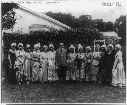 President Coolidge signs the nation's birthday book the Patriot's Pledge of Faith