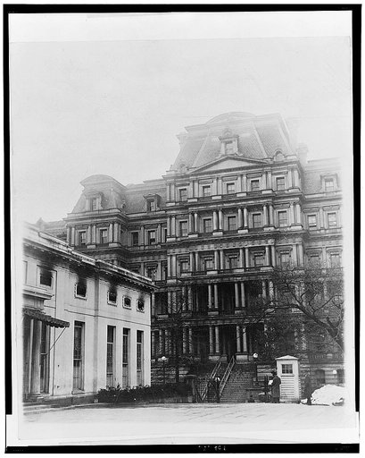 The State, War and Navy Bldg. showing the damaged Executive Offices - the President's office is directly over the entrance to the 2nd floor