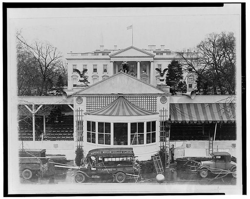 Workmen placing the finishing touches on the reviewing stand in the Court of Honor from which Mr. Hoover will review the inaugural parade