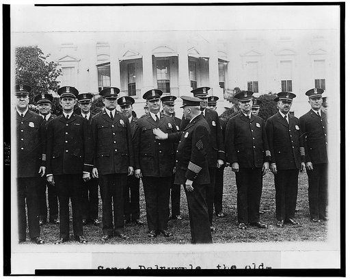 Sergt. Dalrymple, the oldest member of the White House force in point of service, inspecting the force and its new uniforms on the South lawn today