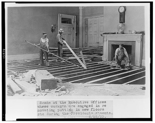 Scene at the executive offices where workmen are engaged in renovating, putting in new floors, etc. during the President's absents [sic