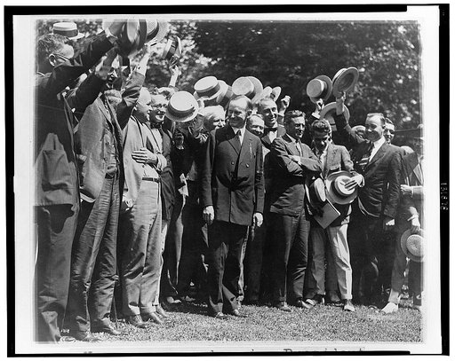Newspapermen cheering President Coolidge after their first conference with him at the White House