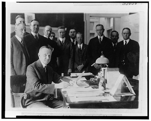 President Coolidge signing the Cameron Bill which authorizes the construction of the Coolidge Dam in Arizona