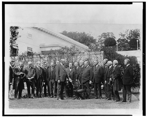 President Harding presenting to the Roosevelt Memorial Society the chair used by President Roosevelt when he was in the White House