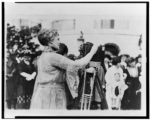 Florence Kling Harding operating a movie camera on the lawn at the White House, Washington, D.C.