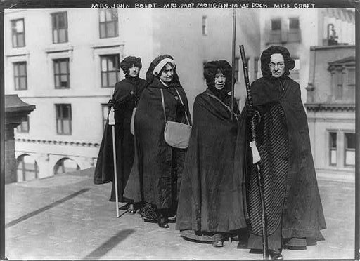 Mrs. John Boldt, Mrs. May Morgan, Miss Dock and Miss Craft [holding "Votes for Women" staff