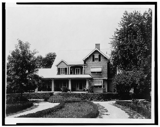 Two story frame house with porch