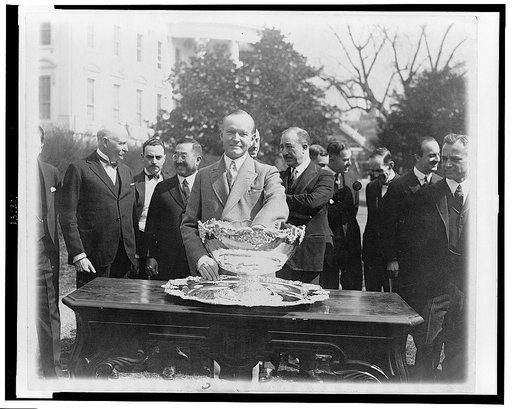 President Coolidge makes tennis draw at White House--Drawing for the Davis Tenni[s] matches was held at the White House with practically all of the Diplomati[c] Corps in Washington looking on