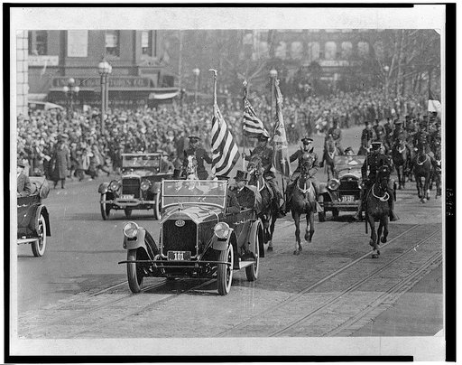 President Coolidge and others riding in a car during the inaugural parade