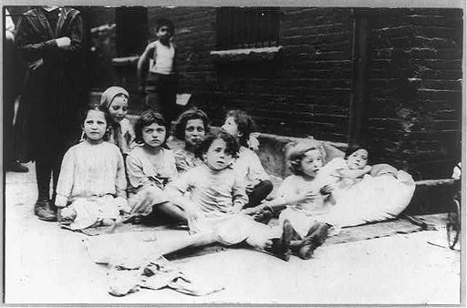 New York City - children on the street: children seated on pavement