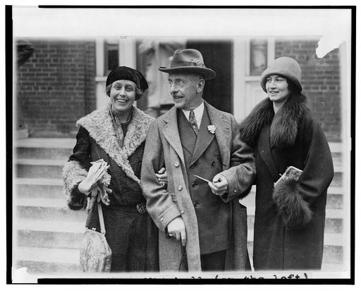 Mrs. William [Caroline Stoddard] Mitchell (on the left), Mr. Sidney Miller, father of Mrs. Mitchell, and Mrs. Arthur Young, sister of Col. Mitchell, snapped after leaving the Emory bldg. where they attended the Mitchell court martial proceedings today
