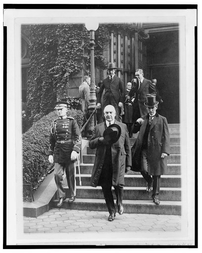 President Harding and his secty. George Christian leaving St. Patricks Church after attending the funeral of Senor Don J. Antonio Lopez Gutierrez, Minister of Honduras, today