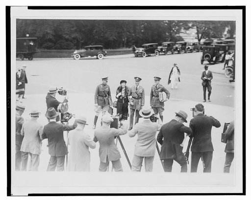 Mitchell, his wife, and aides being photographed before going into the Morrow Aviation Board, Sept. 29, 1925