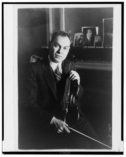 Eddy Brown, half-length portrait, seated, holding his violin