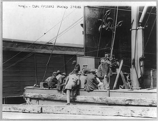 Striking seamen: Coal passers talking strike on boat, 14 June 1911