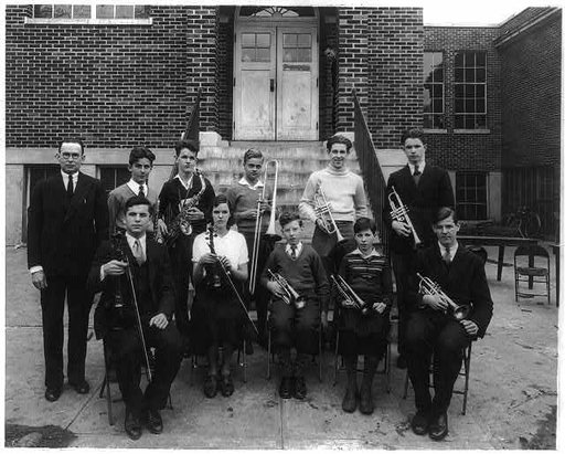 Students at a Washington, D.C. school posed with their teacher and [musical] instruments