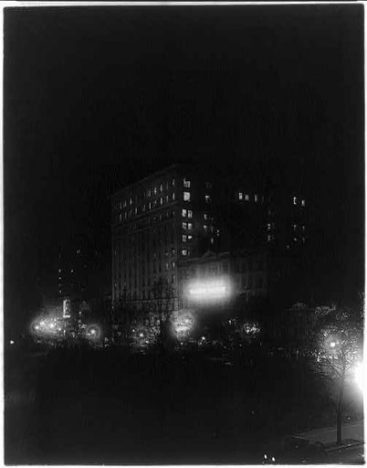 Munsey Building, National Theater and other structures in the 1300 block of E Street N.W., just of Pennsylvania Avenue, Washington, D.C. Illuminated night scene